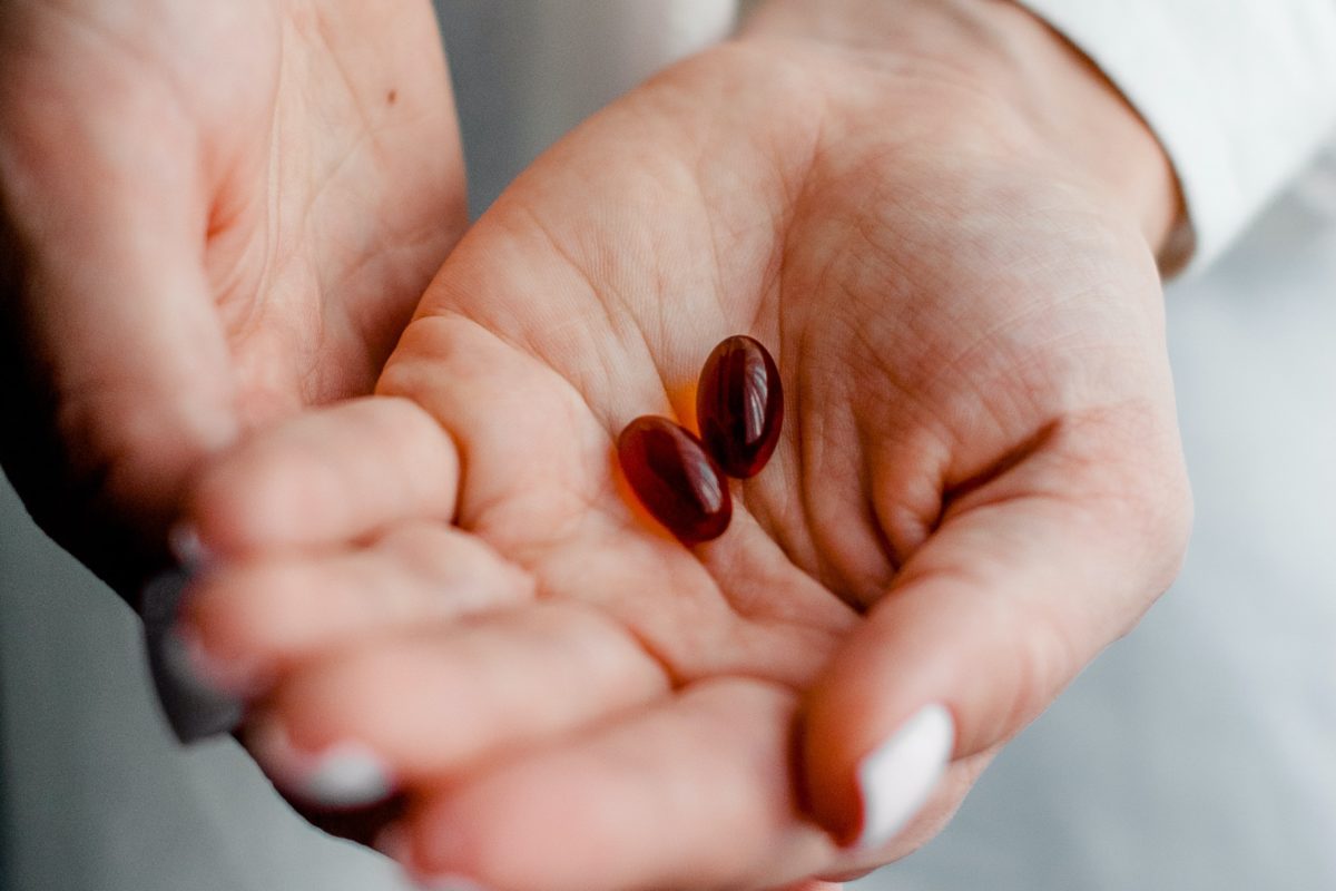 Hands holding pills